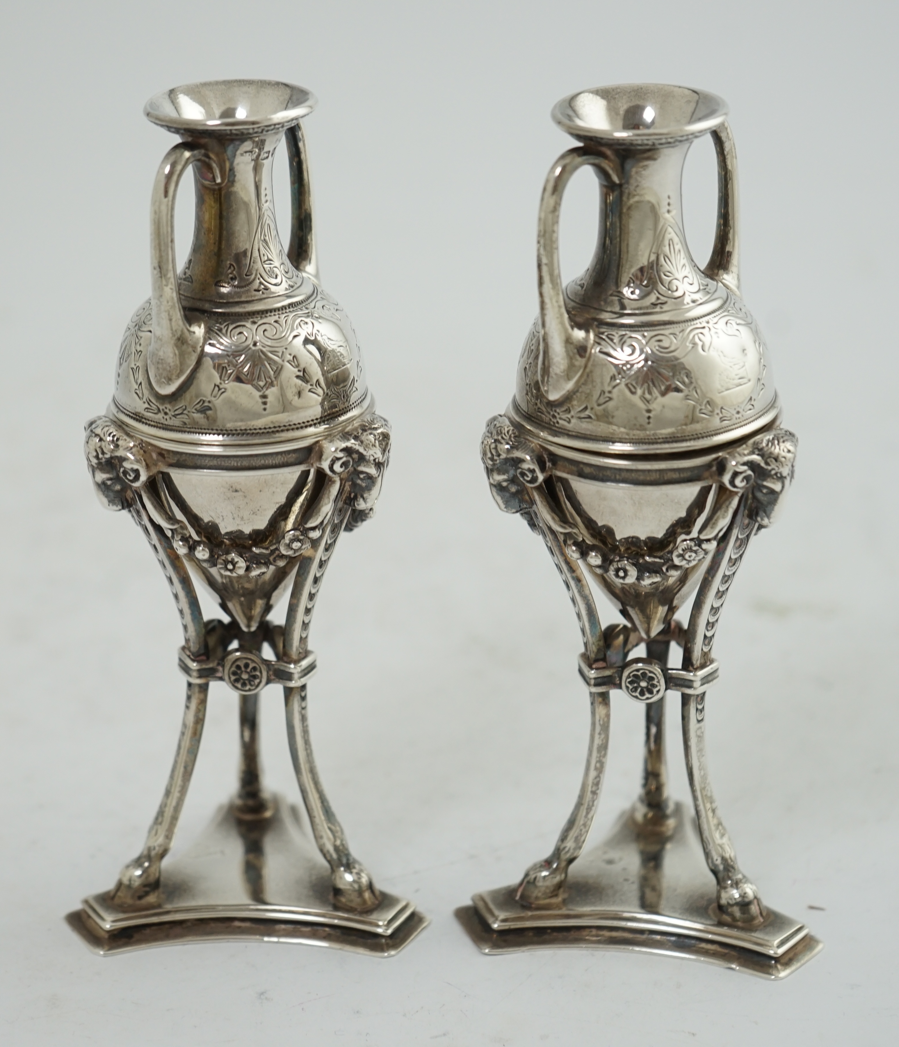 A pair of Victorian silver miniature urns on stands, by William & John Barnard